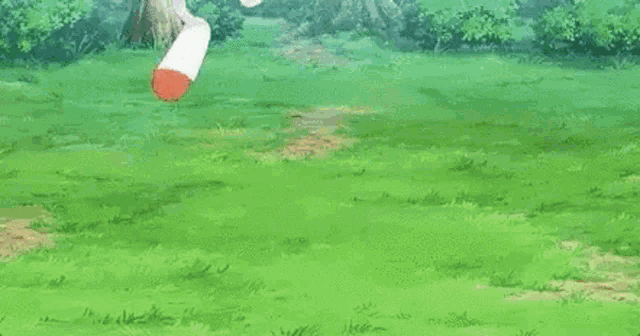 a cartoon rabbit is standing in a grassy field .