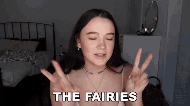 a woman with her eyes closed and the words the fairies above her