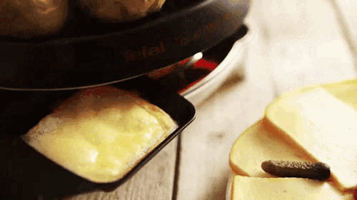 a close up of a tray of food with a tefal logo on it
