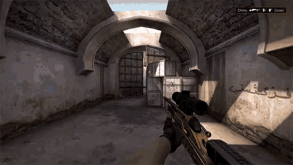 a person is holding a sniper rifle in a room with arabic writing on the walls