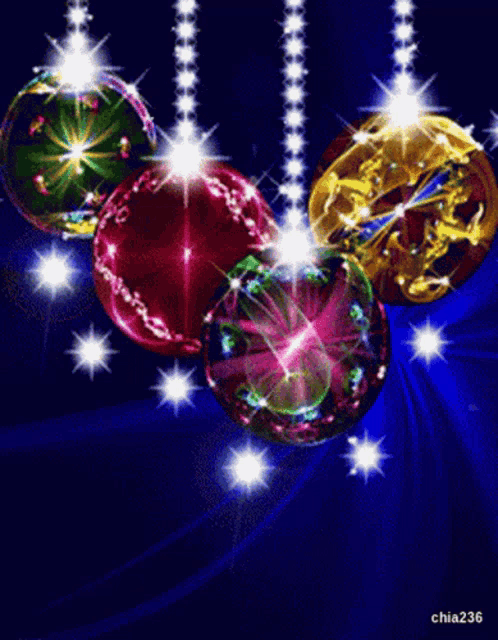 colorful christmas balls are hanging from strings with chia236 written on the bottom