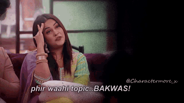 a woman sits on a couch with the words phir waahi topic bakwas