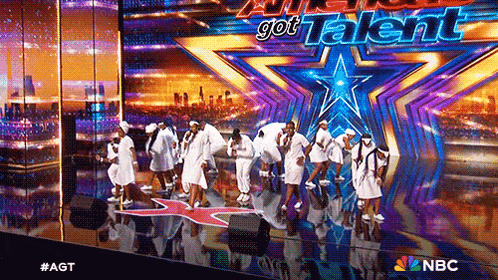 a group of people are dancing on a stage in front of a sign that says " got talent "