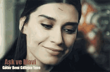 a close up of a woman 's face with the words ask ve mavi
