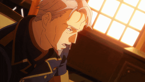 a man with gray hair and a beard looks down
