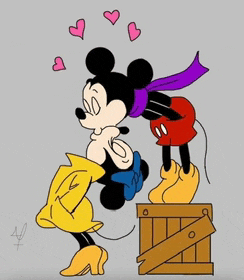 mickey mouse and minnie mouse are kissing on a wooden box