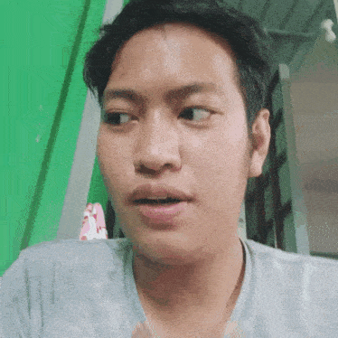 a close up of a man making a funny face