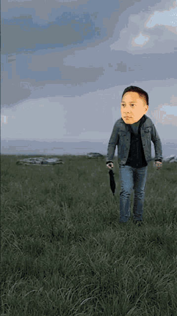 a man holding an umbrella in a grassy field with a car in the background