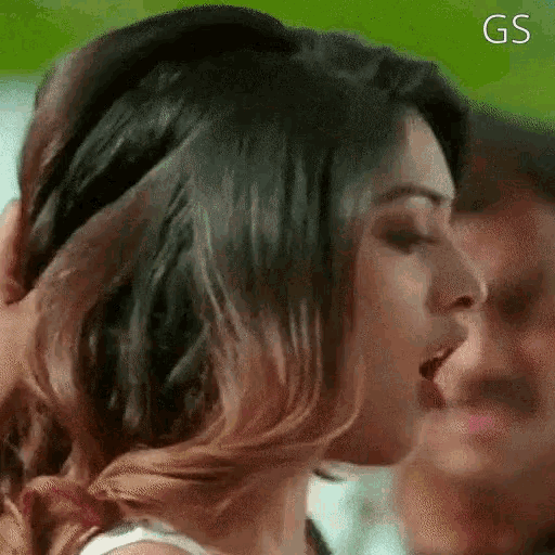 a close up of a woman 's face with the word gs written on the bottom