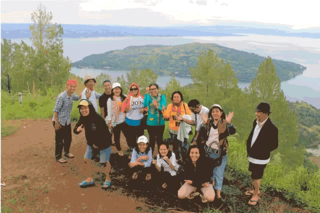 a group of people posing for a picture with one wearing a shirt that says 2018 indonesia