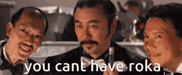 three men in tuxedos are standing next to each other with the words " you cant have roka " written in white