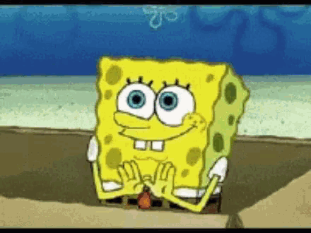 a spongebob squarepants cartoon character is sitting on the beach