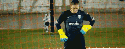 a soccer goalie wearing a blue shirt that says modo on it