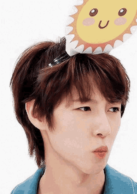a young man is wearing a sun hat on his head .