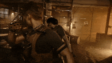 a man with a backpack stands in a dark room with a sign that says ' a ' on it