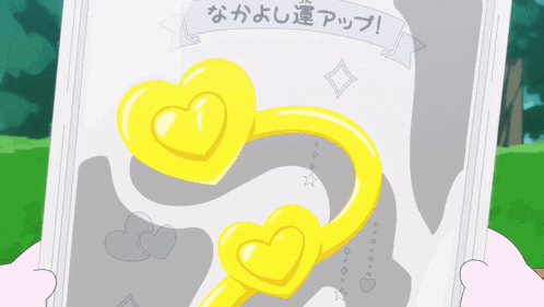 a person is holding a piece of paper with a picture of two yellow hearts on it