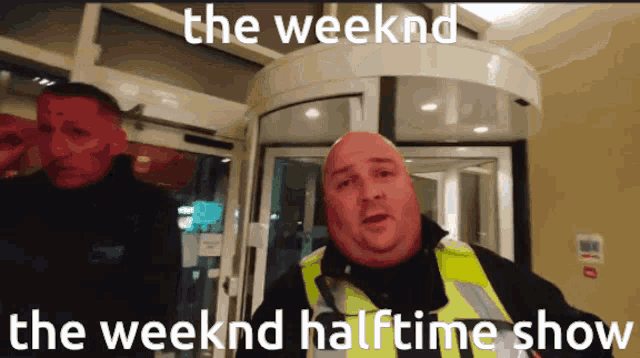 a man in a yellow vest stands in front of a revolving door with the words " the weekend halftime show " written on it