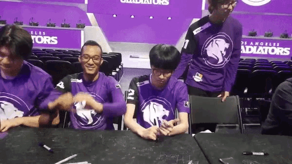 a group of people wearing purple shirts that say gladiator on them