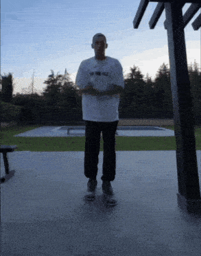 a man wearing a shirt that says " just your falls "