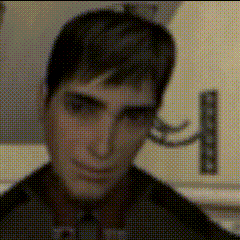 a close up of a man 's face with a polka dot pattern