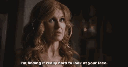 a woman in a dark room says i 'm finding it really hard to look at your face