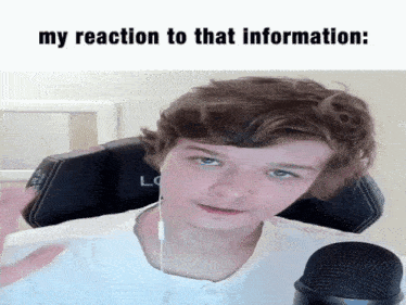 a young man is sitting in front of a microphone with the words `` my reaction to that information '' below him .