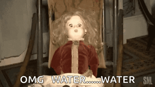 a doll is sitting in a rocking chair with the words " omg water water " above it .