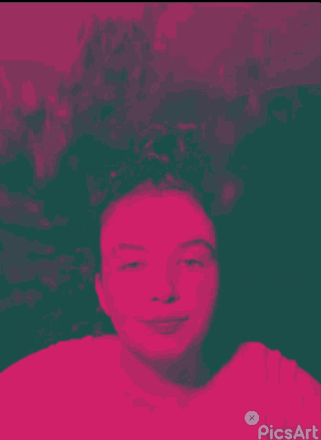 a pink and green photo of a girl with picsart written on the bottom right
