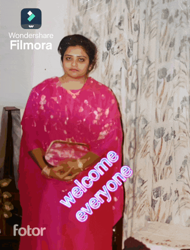 a woman in a pink dress is standing in front of a curtain with the words welcome everyone written on the bottom