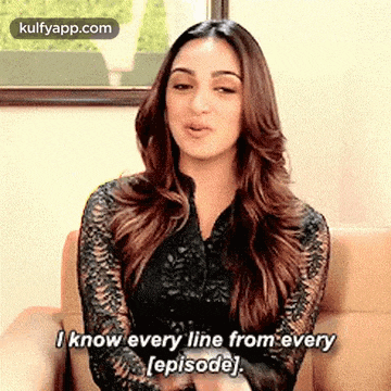 a woman is sitting on a couch and saying `` i know every line from every [ episode ] '' .