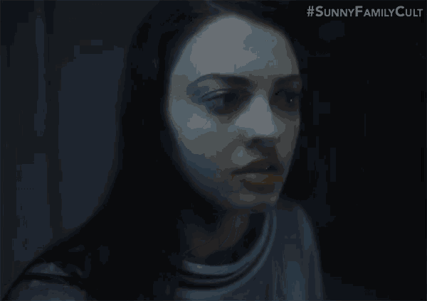 a close up of a woman 's face with the hashtag #sunnyfamilycult on the bottom right