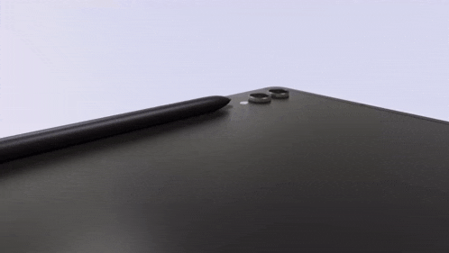 a black samsung tablet with a pen on top