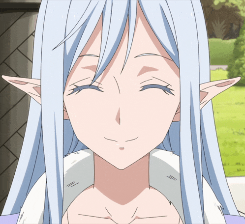 a girl with long white hair and elf ears smiles