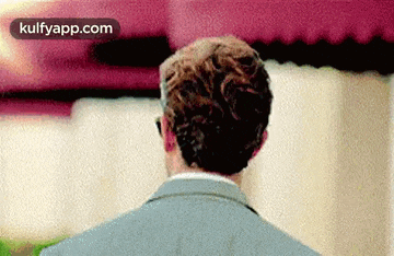 the back of a man 's head is shown in a blurred image .