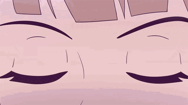 a close up of a person 's eyes with a slight smirk on their face