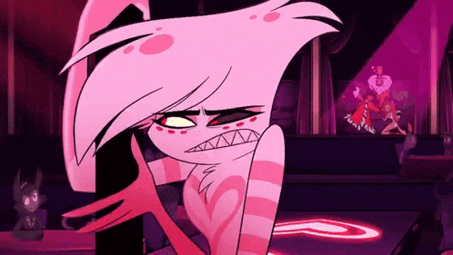 a pink cartoon character is standing in a dark room with a heart on her chest .