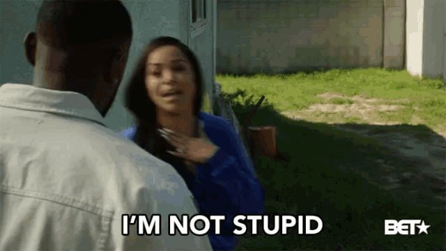 a woman says i 'm not stupid while a man looks on