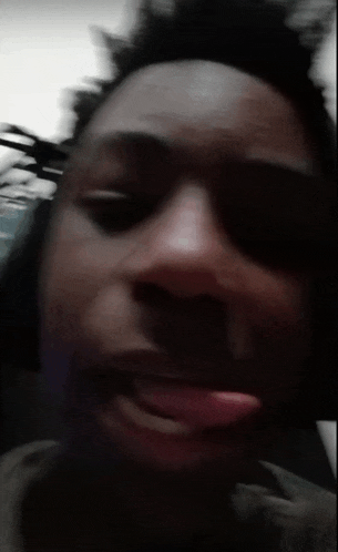 a close up of a person 's face with their mouth open