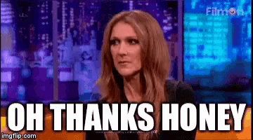 a woman is sitting on a stage with the words `` oh thanks honey '' written above her .