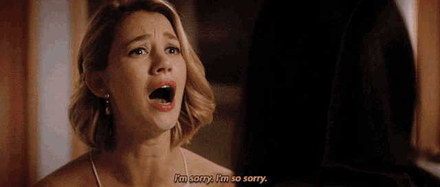 a woman says i 'm sorry i 'm so sorry in yellow letters