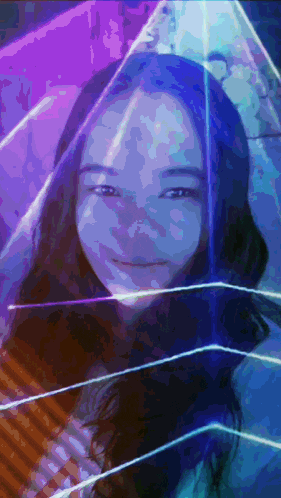 a woman 's face is surrounded by a purple and blue light