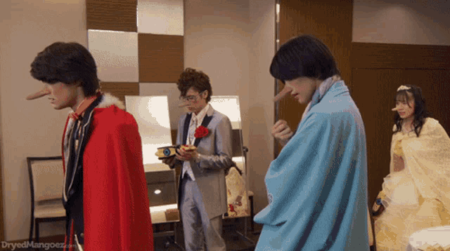 a group of people are standing in a room with the words dryedmangoez.com on the bottom