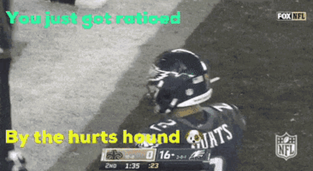a football player wearing a saints jersey stands on the field