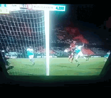a soccer game is being played in a stadium with a sign that says #laligawin