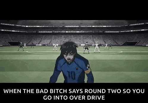 a soccer player is standing on a soccer field in front of a crowd and a stadium .