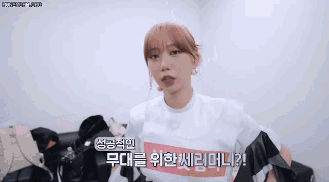 a woman wearing a t-shirt that says ' seoul ' on it