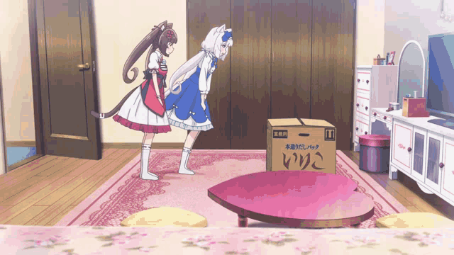 two anime girls are standing next to a cardboard box that says " i " on it