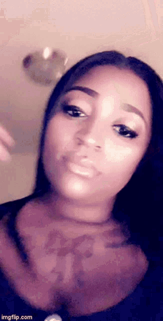 a close up of a woman 's face with the website imgflip.com visible