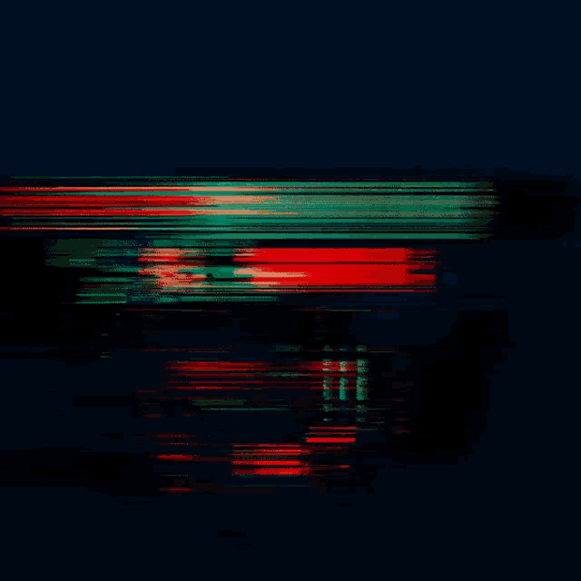 a red and green triangle against a dark blue background