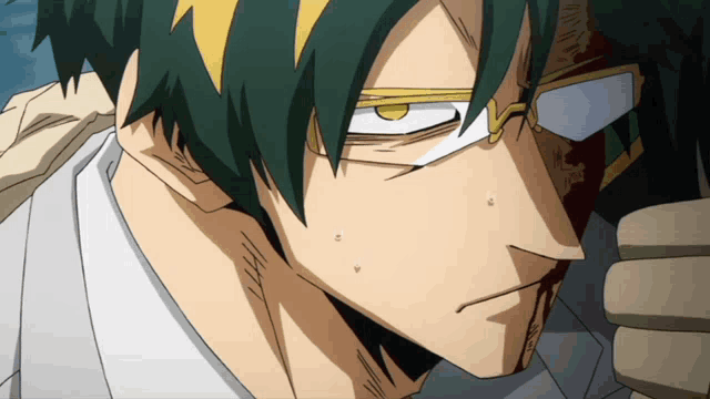 a close up of a man 's face with glasses